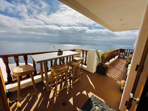 - Soak up panoramic ocean views while relaxing on this scenic terrace oasis
- Watch parasailers glide across the sea from your own outdoor dining perch
- Spacious layout with tropical plants and cozy seating completes the vibe