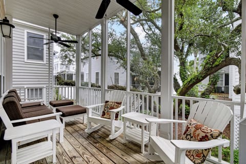 Relax on your screened porch with comfortable seating, ceiling fans, and peaceful tree-lined views—your private retreat for morning coffee or evening unwinding.