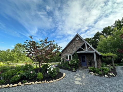 Provincial Inspired Stone Cottage. View of entrance from the driveway.