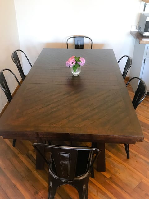 dining table open to kitchen and living room