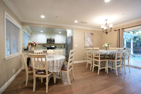 Dining Room with ample seating at both tables and Kitchen Counter