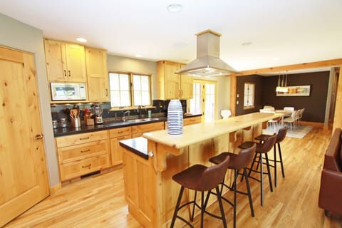 The bar seats an additional four people.