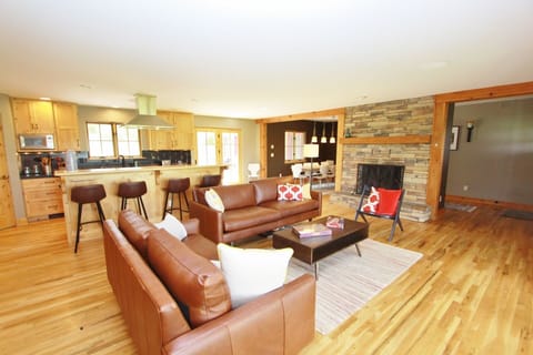 The living room is adjacent to the kitchen and dining room.