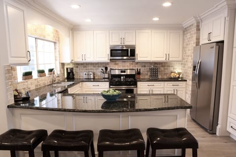 Custom Kitchen with Granite Countertops and Stainless Steel Appliances