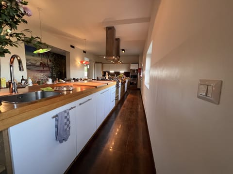 super b, large kitchen, with manu freezers and coffee machines.