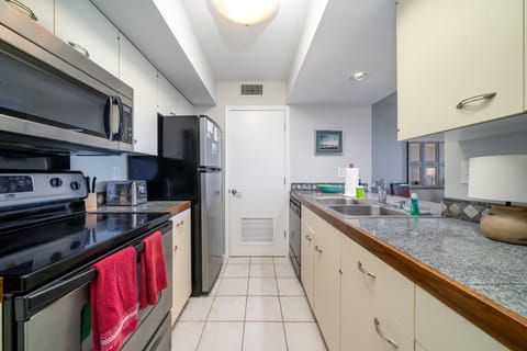 It has well stocked cabinets and there is a stacked washer/dryer in the closet.