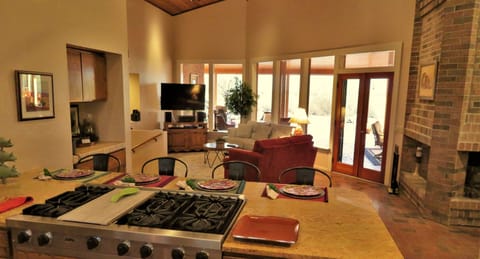 Seating that is convenient to what is going on in the kitchen.