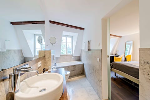 Separate tub and shower, free toiletries, hair dryer, slippers