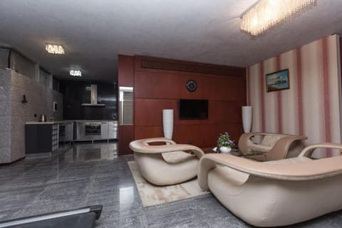 Luxury Apartment, Multiple Beds | Living area | Flat-screen TV, DVD player, streaming services