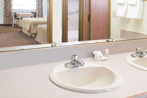 Combined shower/tub, hair dryer, towels, soap