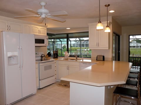 Fully equipped kitchen with beautiful water view of the canal.