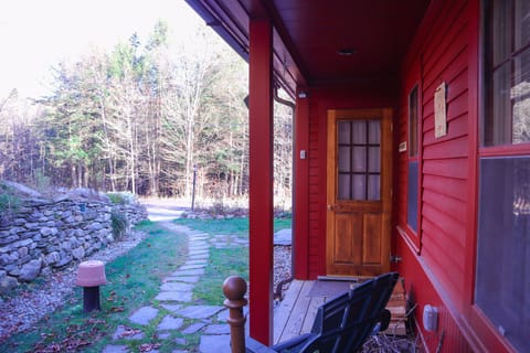 Farmhouse Style front porch with flowing river. 
