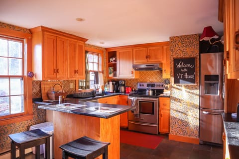 Our kitchen is stocked with a coffee maker, pots, pans and cookware and utensils