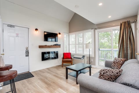 Living Room area with flat screen tv and electric fireplace.