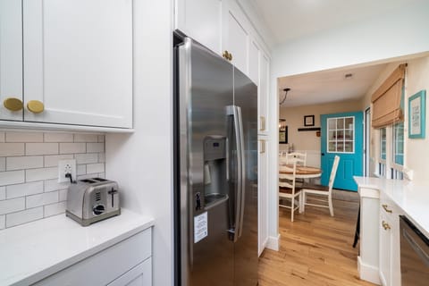 The galley kitchen sits next to the dining area.