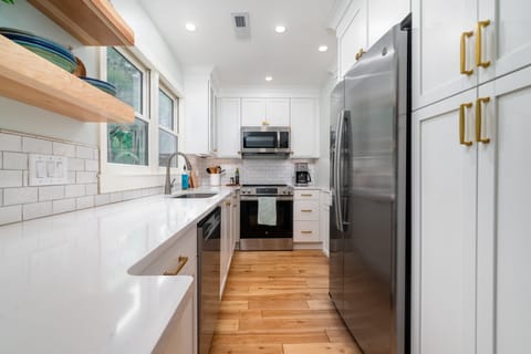 Granite counter tops. Well stocked cabinets for preparing those vacation meals!