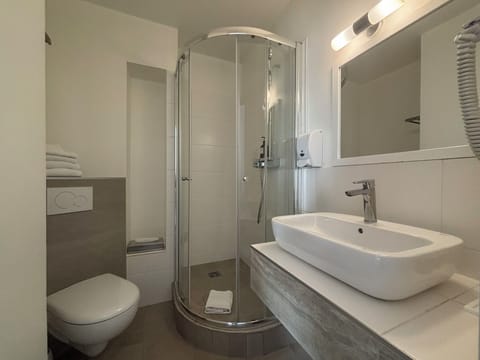 Comfort Room, Courtyard View | Bathroom | Eco-friendly toiletries, hair dryer, towels, soap