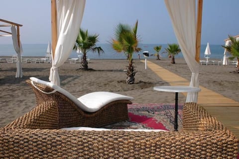 Private beach, white sand, sun loungers, beach umbrellas