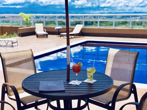 Outdoor pool, pool umbrellas, sun loungers