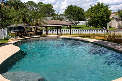 Resort style pool with canal view.