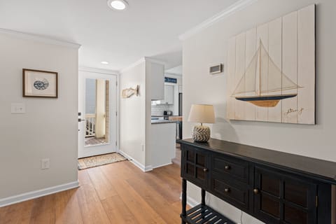 You enter through the front door into a light filled, beautifully decorated beach home.