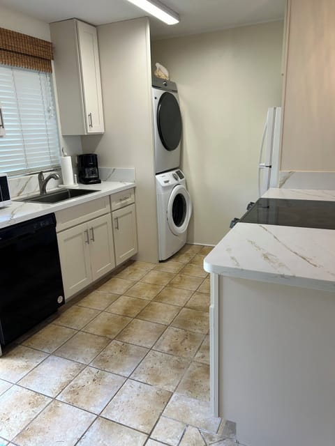 Spacious kitchen with new appliances including refrigerator with icemaker