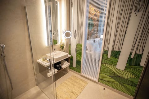 Suite | Bathroom | Designer toiletries, hair dryer, bathrobes, slippers