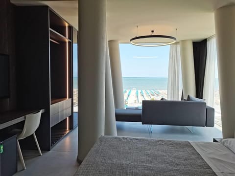 Panoramic Studio Suite, Sea View | Minibar, in-room safe, individually decorated, desk