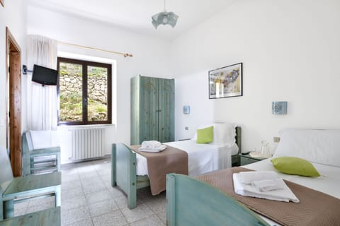 Basic Quadruple Room | Down comforters, iron/ironing board, free WiFi, bed sheets