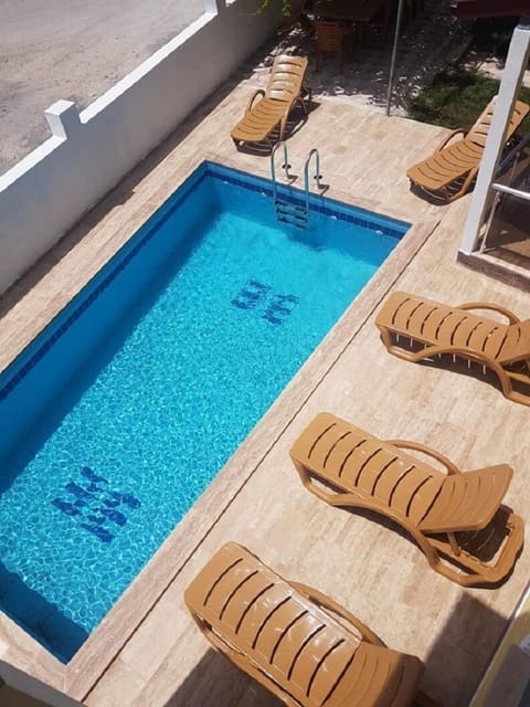 Outdoor pool, pool umbrellas, sun loungers