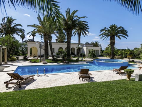 Water, Plant, Building, Swimming Pool, Tree, Azure, Outdoor Furniture, Shade, Sky, Arecales