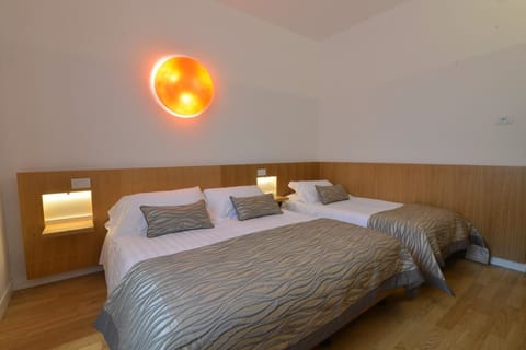 Triple Room | Minibar, in-room safe, desk, soundproofing