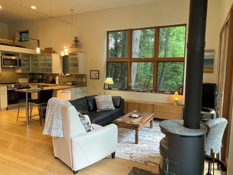 Open floor plan main level with optional wood stove