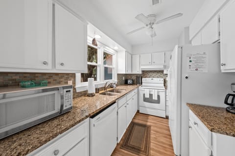 The kitchen has granite counter tops