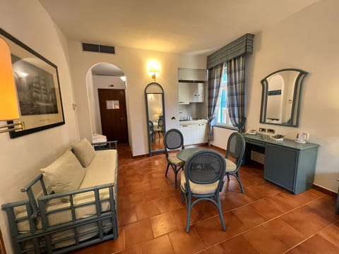 Family Room | Down comforters, minibar, in-room safe, desk