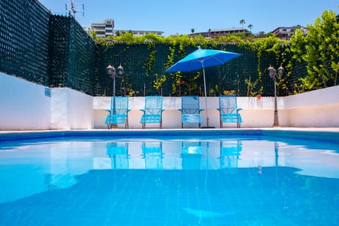 Outdoor pool, open 9:00 AM to 9:00 PM, sun loungers