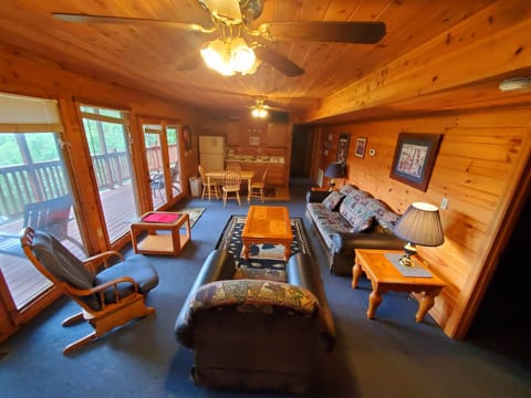 Second living room with wood burning fireplace, 48” HDTV, and Panoramic windows