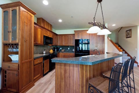 Fully Stocked Kitchen with Breakfast Bar (Seating for Three)