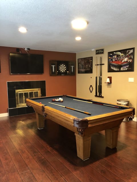 Entertainment Room—pool table TV dart and relaxing sofa bed. 