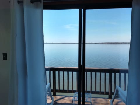 View of the beautiful lake from boathouse balcony rocking chairs