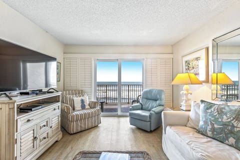 Spacious living room area with access to the balcony.