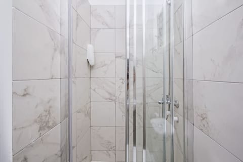 Shower, free toiletries, hair dryer, slippers