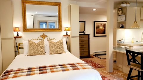 Queen bed with charging station at headboard