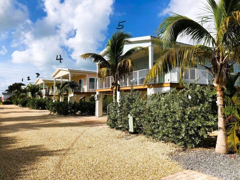 Keys Cove Resort Villages #1 thru #5.   Keys Cove is Eight Houses in total.  5 off water-some  with partial Waterviews from the upper balconies and 3 homes directly facing the Ocean.   House #5 is closest to the beach area gate, and house #1 is closer to Overseas Hwy A1A.  All our homes have identical floorplans and sleeping arrangements plus nearly identical decor.