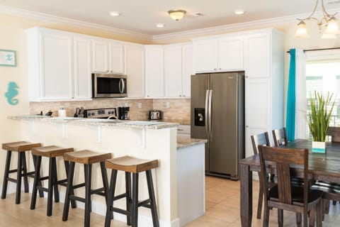 Kitchen -fully stocked-Stainless Steel and Granite with Eating Bar seating for 4 and Island area 