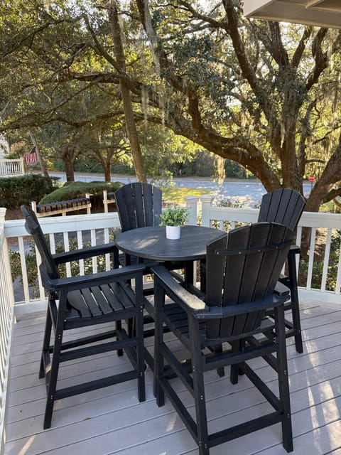 The side deck off the dining room is a cozy spot.