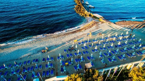 On the beach, sun loungers, beach umbrellas, beach towels