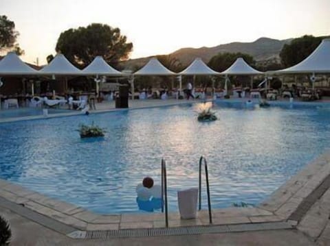 Outdoor pool, open 9:00 AM to 7:00 PM, sun loungers