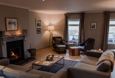 Exclusive House | Living area | Flat-screen TV