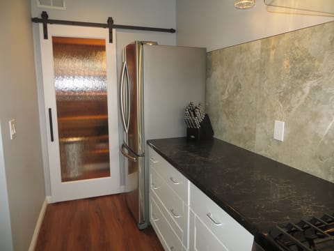 Kitchen, showing barn door entry to pantry